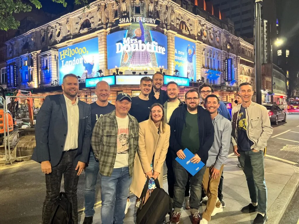 A West End Outings group outside a London theatre before a gay theatre event