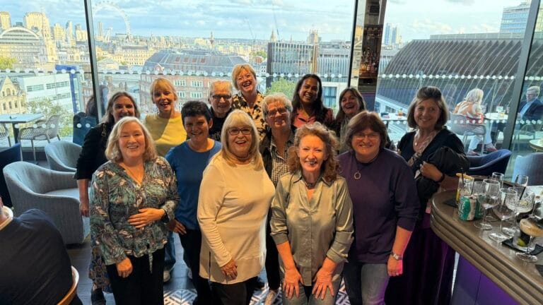 Matinee Club members at a rooftop bar above the London skyline before an afternoon performance