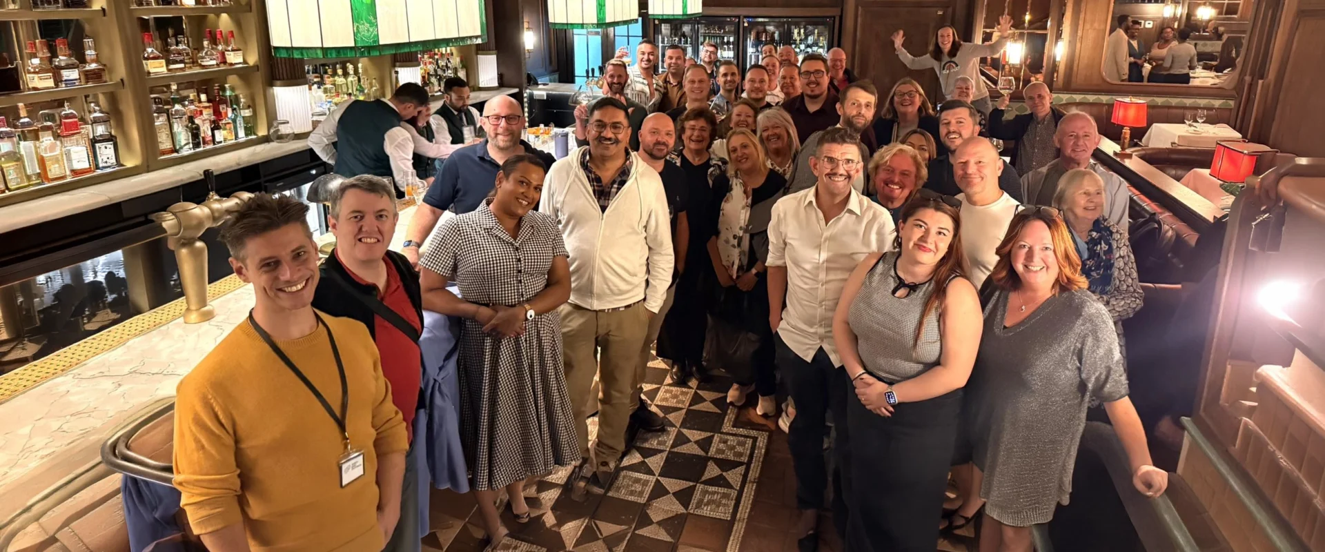Theatre fans making friends over drinks in a London pub before a show